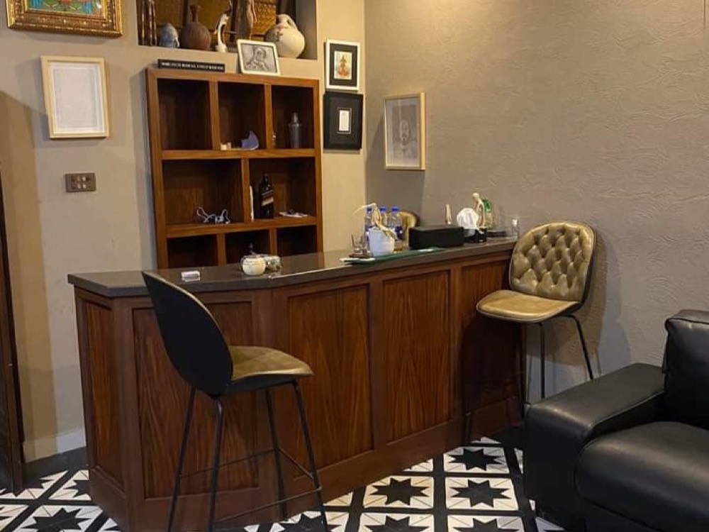Bar interior with a black and white star-pattern floor